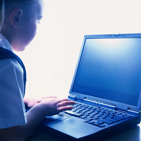 Partially sighted student working on a laptop