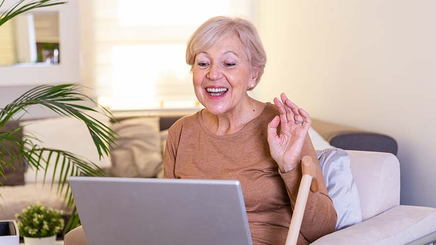 Mature lady happily making a video call