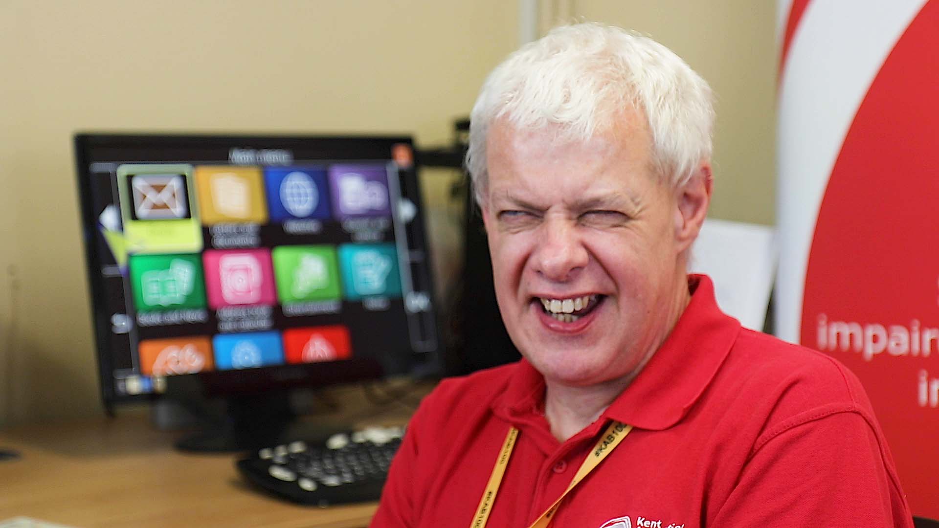 Assistive technology work, Steve from KAB, facing the camera and laughing.