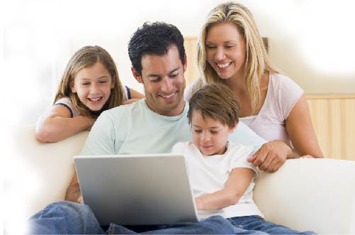 A family sat around laptop