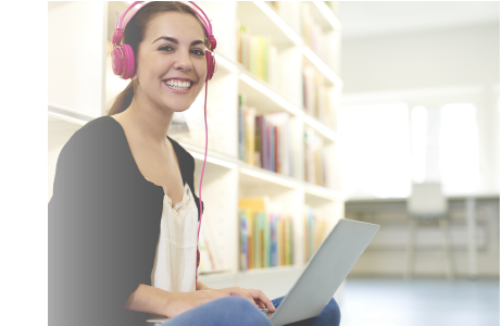 Student using EasyReader on a laptop, wearing headphones