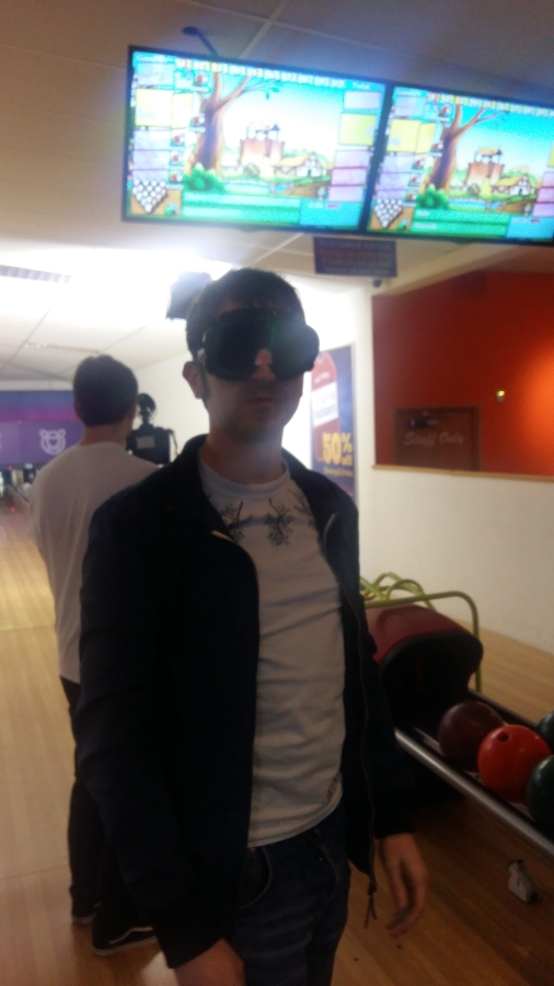Shaun wearing blackout goggles at the bowling alley