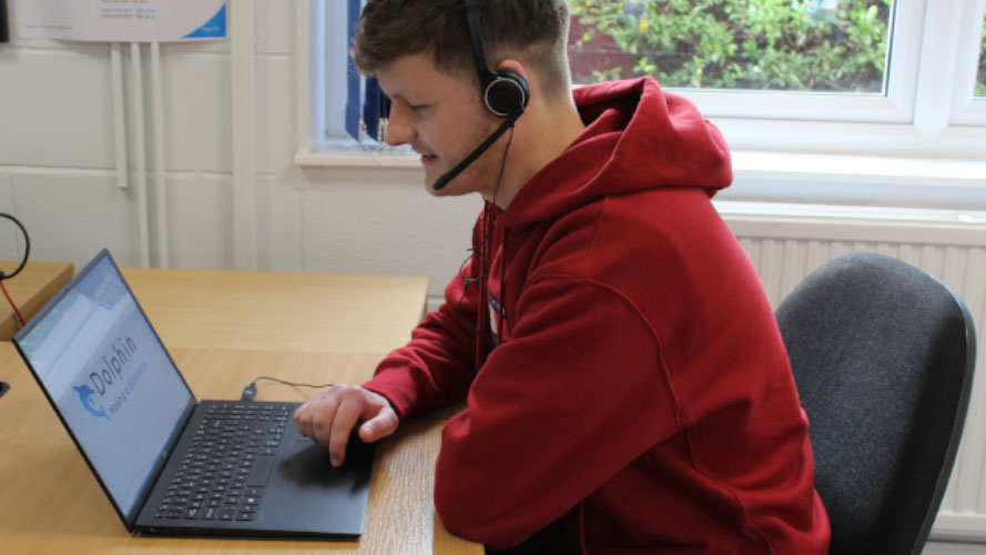 Jake working at his laptop