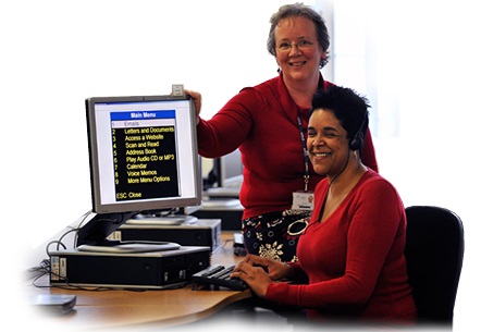 Photo of Lisa and her tutor Jo sitting in the computer room at Dudley College