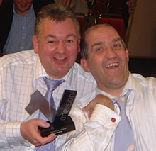 Photo of Noel Duffy and Dave Salisbury of Dolphin celebrating with the One Vision award in their hands